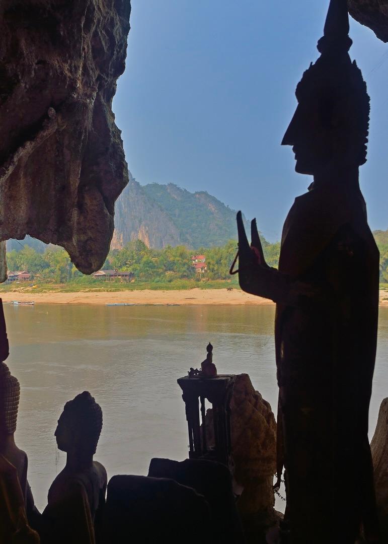 Buddha statues in a riverside cave above the Mekong in Laos